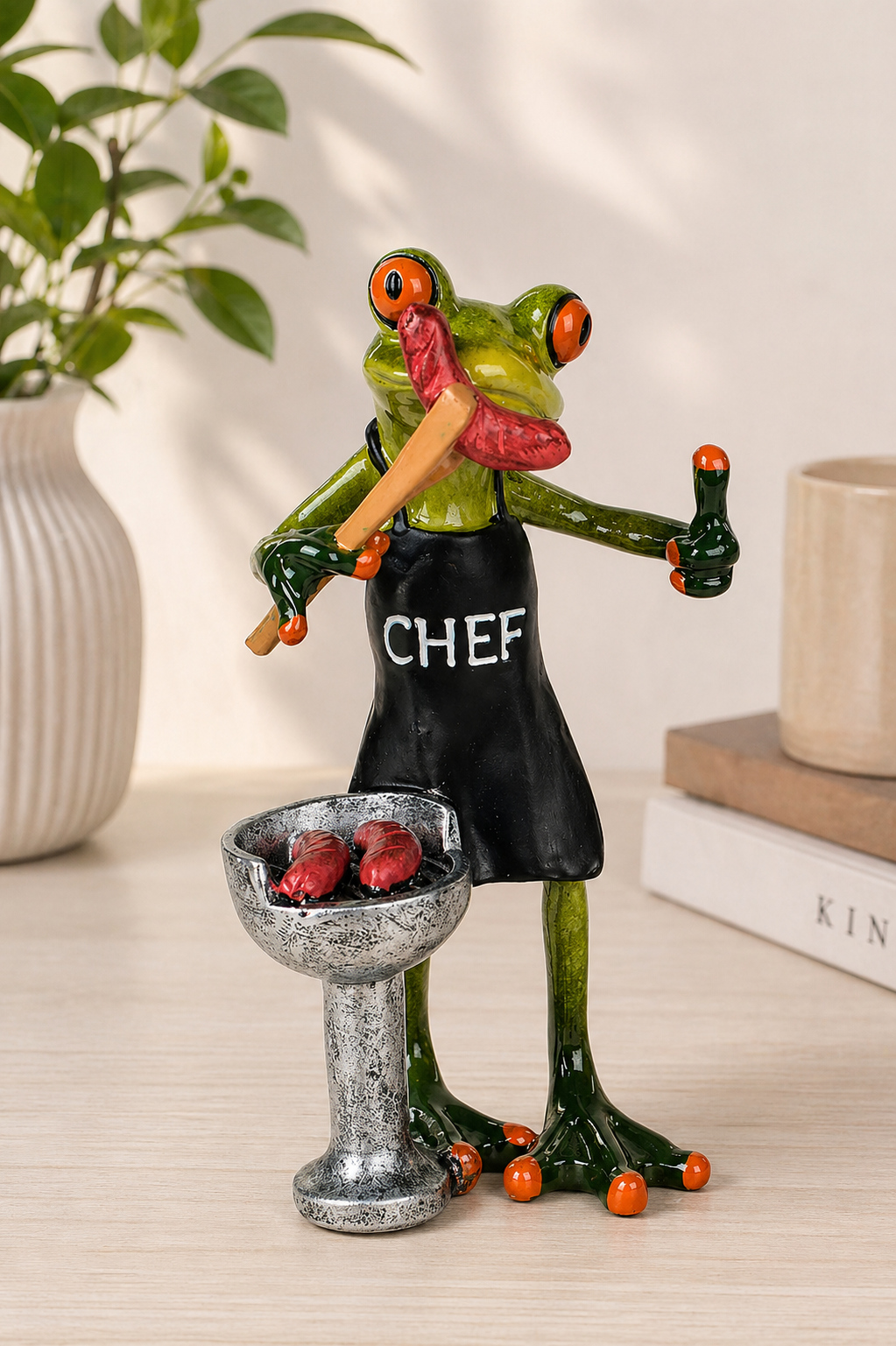 Deko Frosch Fridolin Grill 17cm mit Wurst am Mund hellgrün