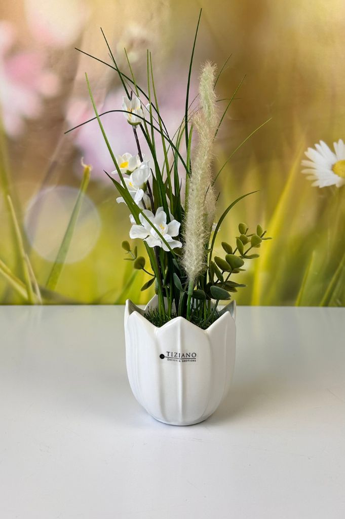 Deko Blumen farbig auf Grassockel