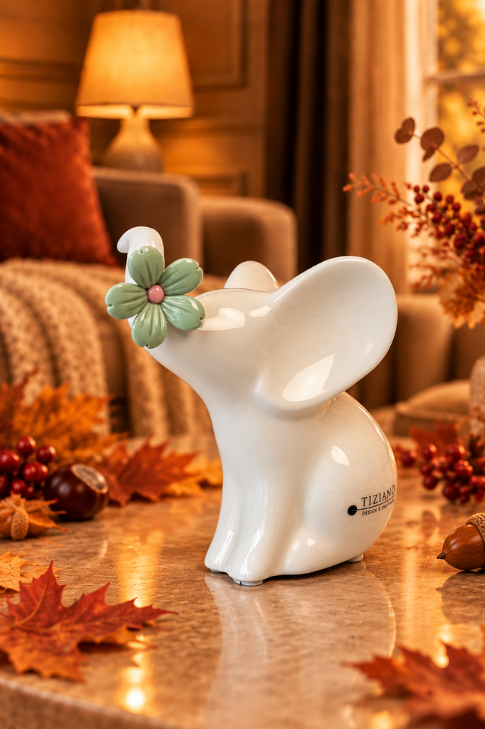 Elefant Leon 12cm sitzend mit grüner Blüte